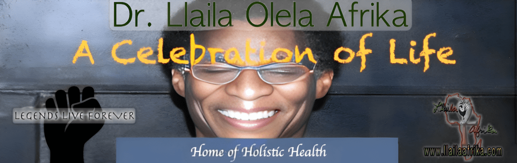 Smiling person with glasses under celebratory banner